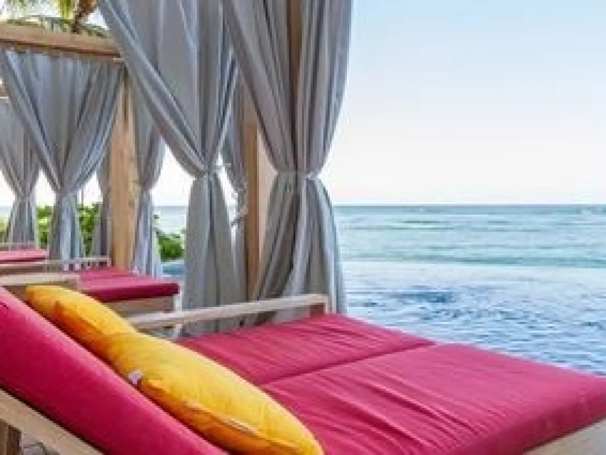 a large bed sitting in a chair